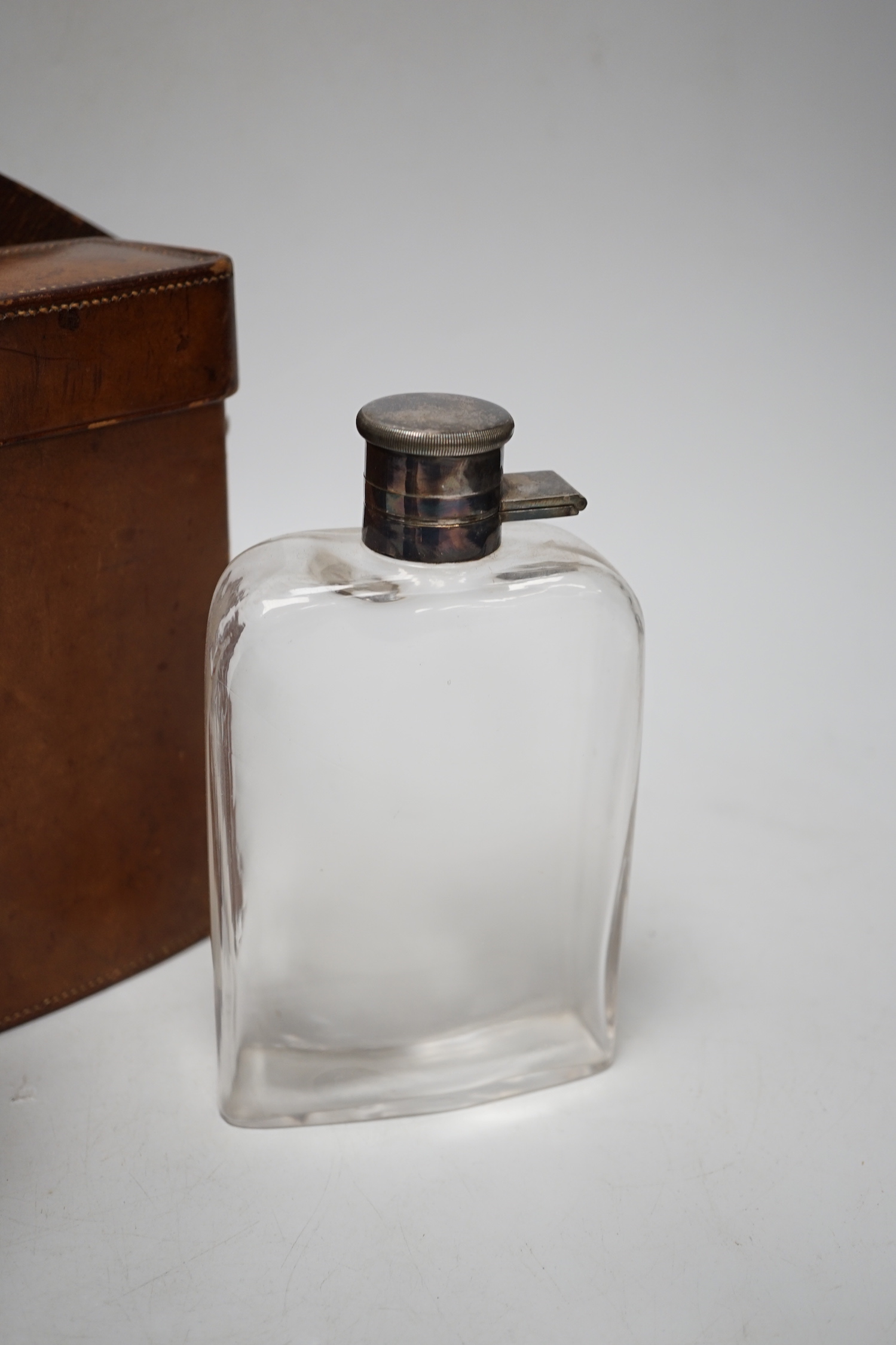 An early 20th century tan leather-cased silver plated hip flask and sandwich box, case 22cm wide